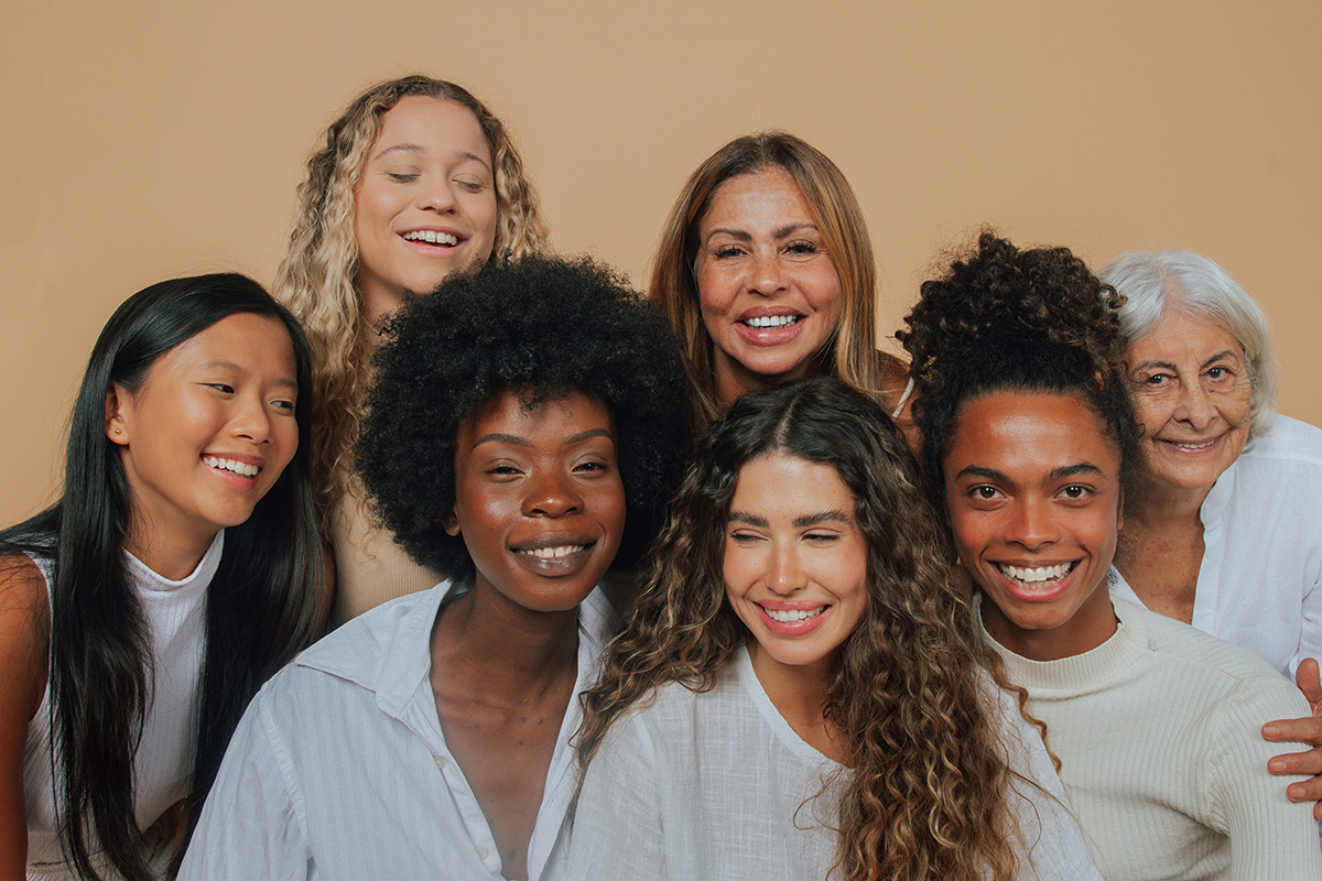 group of women smiling, living healthy happy lives